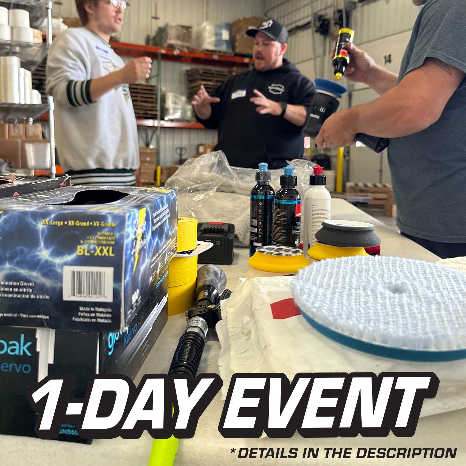 Three men in a workshop setting with automotive products on a table, including a box labeled 'BLXXL' and '1-Day Event' text.
