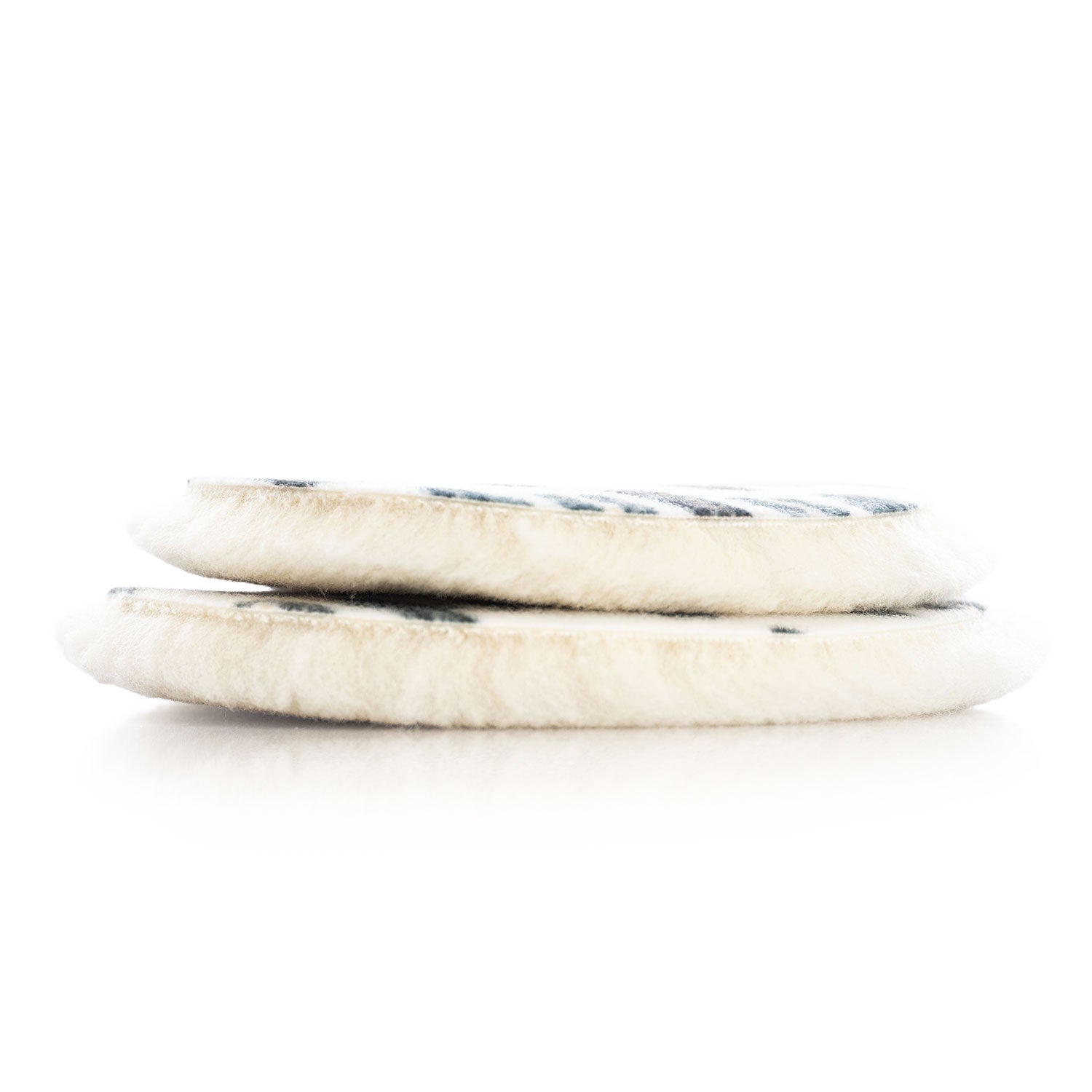 Natural Uro Wool Pads stacked on a white background