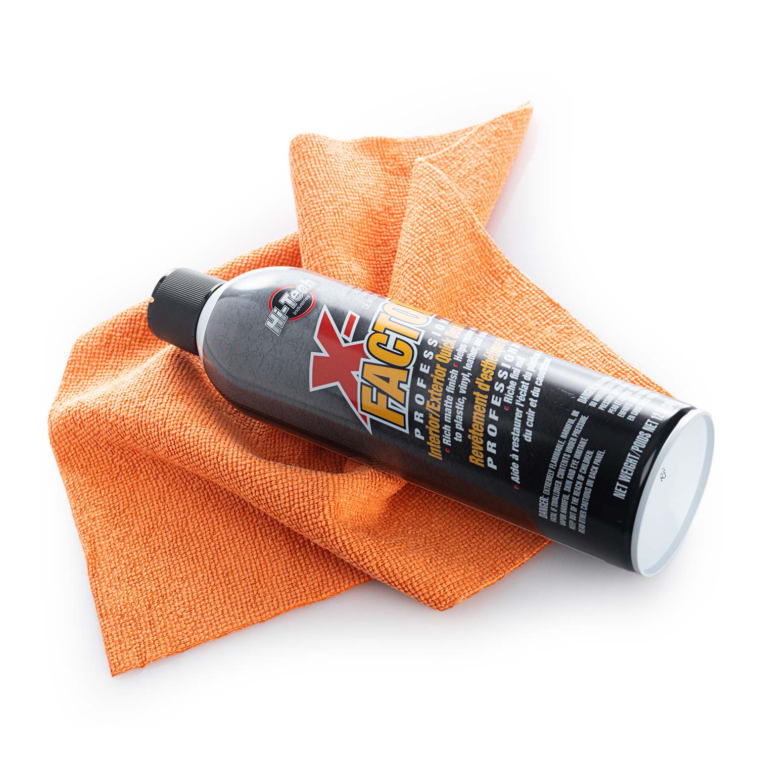 X-factor car care product on an orange microfiber cloth with a white background