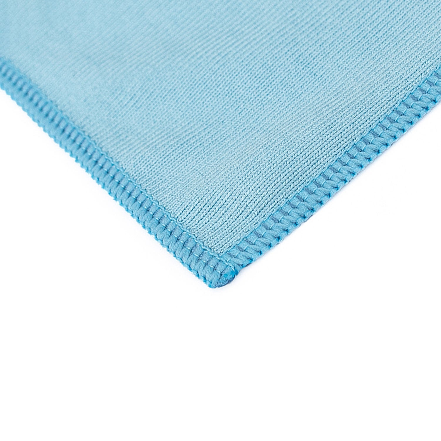 Close-up of a blue textured glass towel on a white background