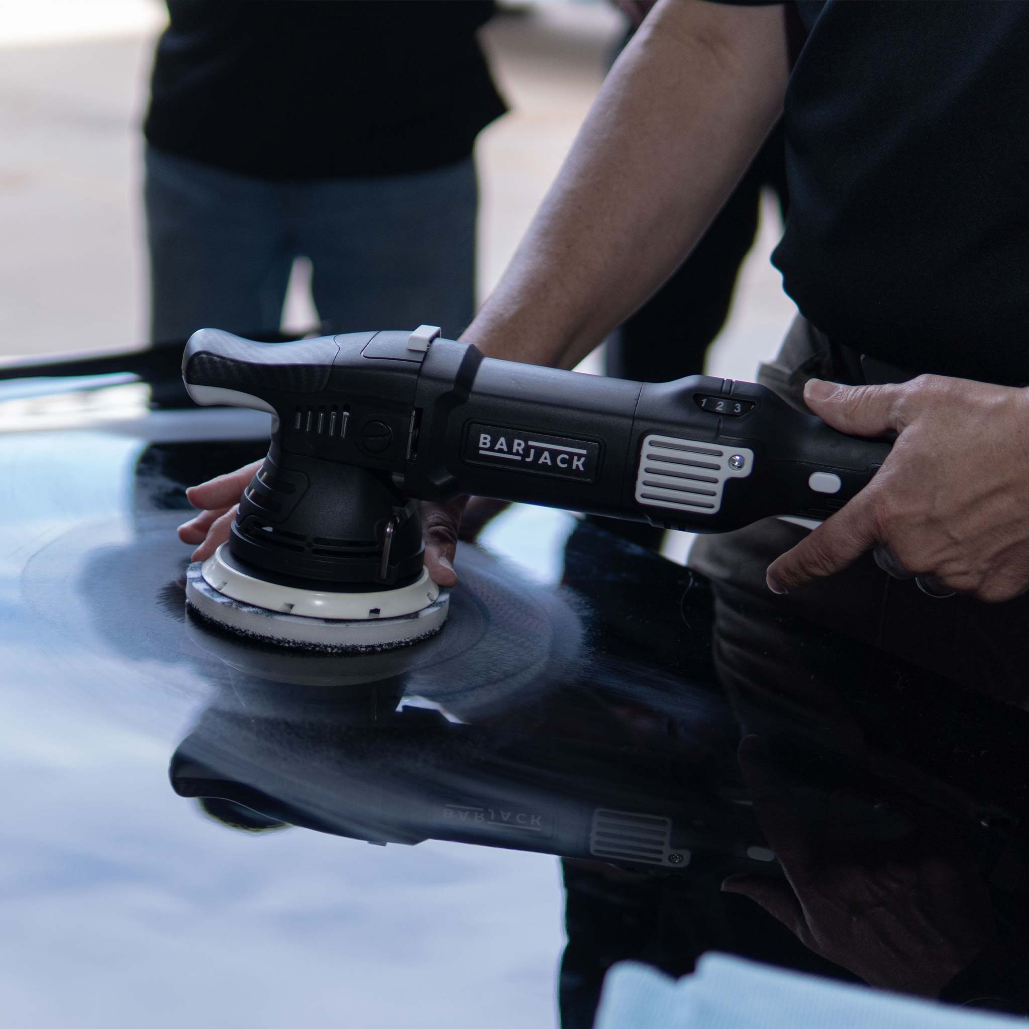 Barjack buffer with a 592mfp pad on a car hood