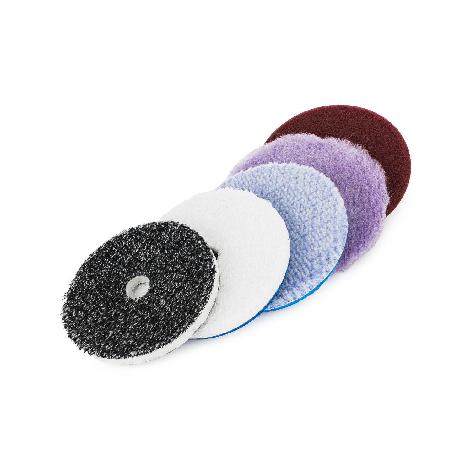 Set of five different colored buff and shine buffing pads on a white background