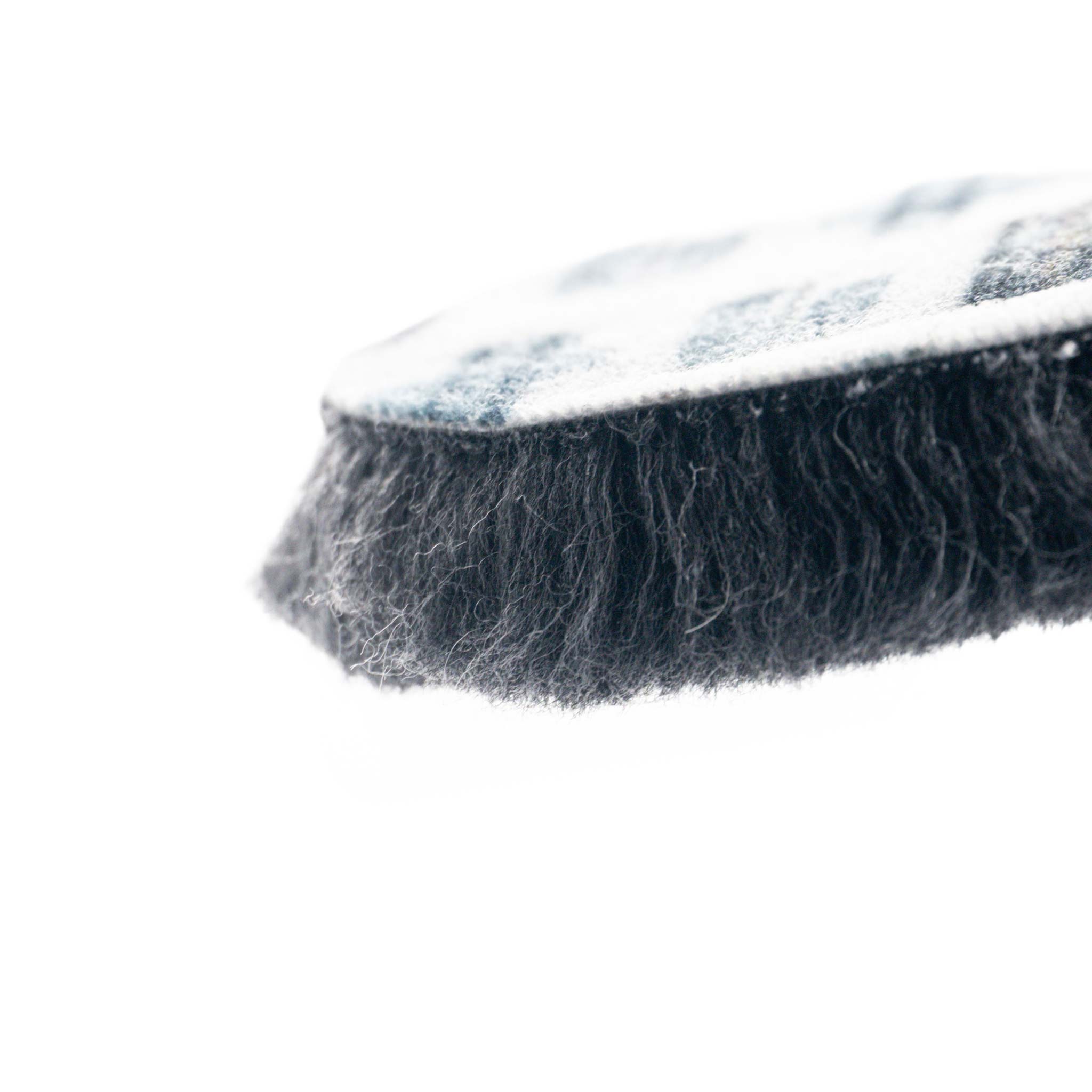 Close-up of a Dark grey wool pad on a white background
