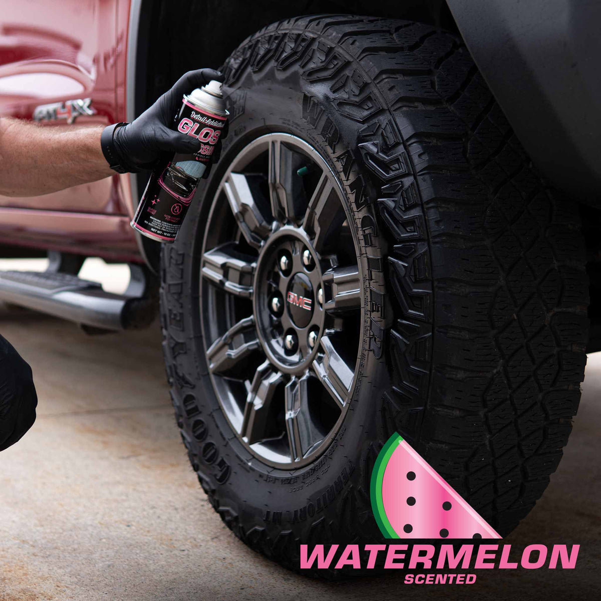 Detail Addictions Premium Gloss Dressing sprayed on a truck tire for a watermelon scented tire shine