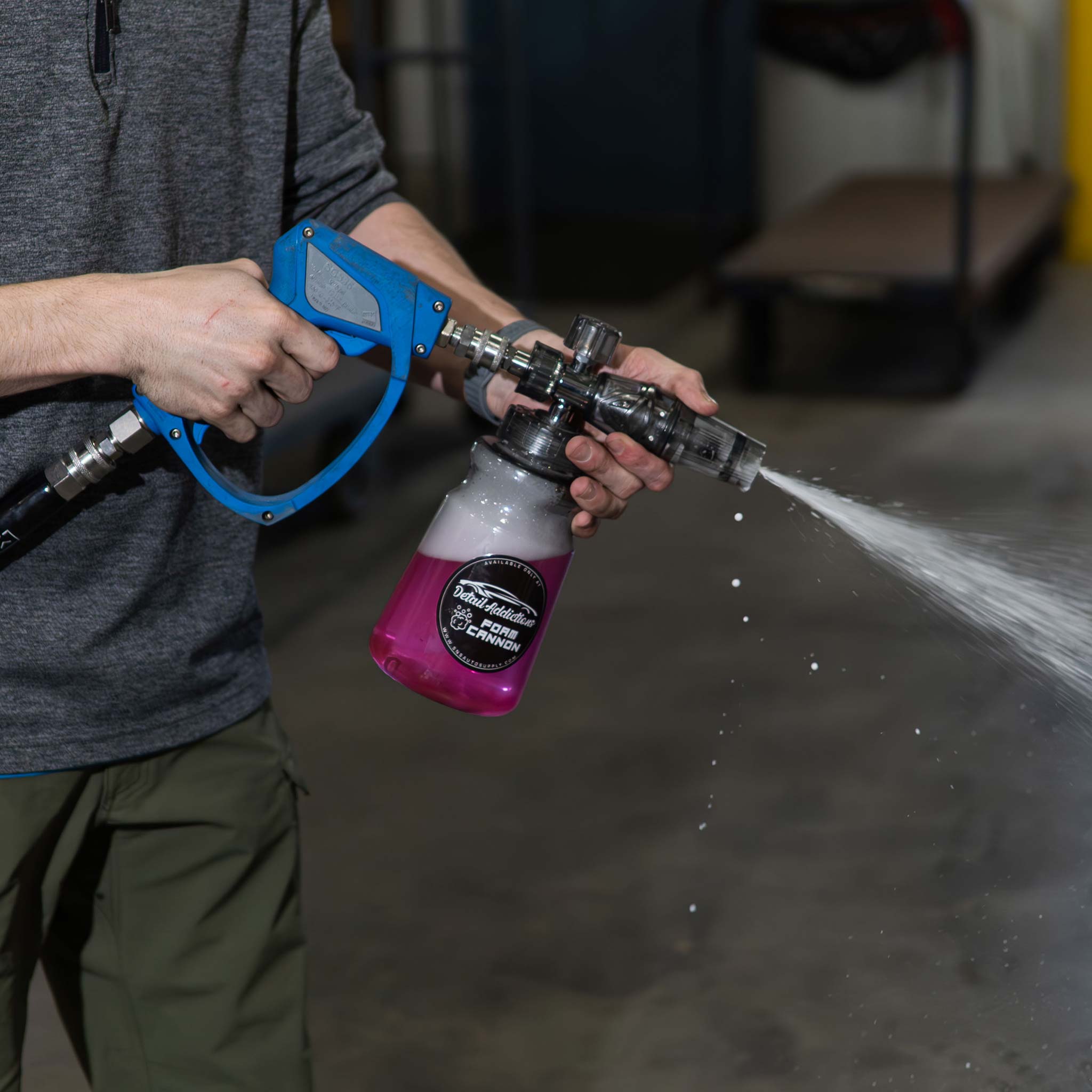 detail addictions clear foam cannon in use in a shop setting