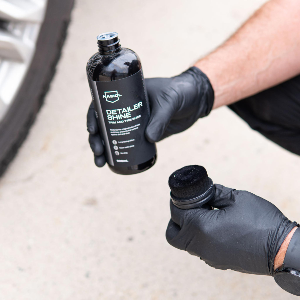 Nasiol Detailer Shine trim and tire dressing beside the Detail Addictions dressing brush