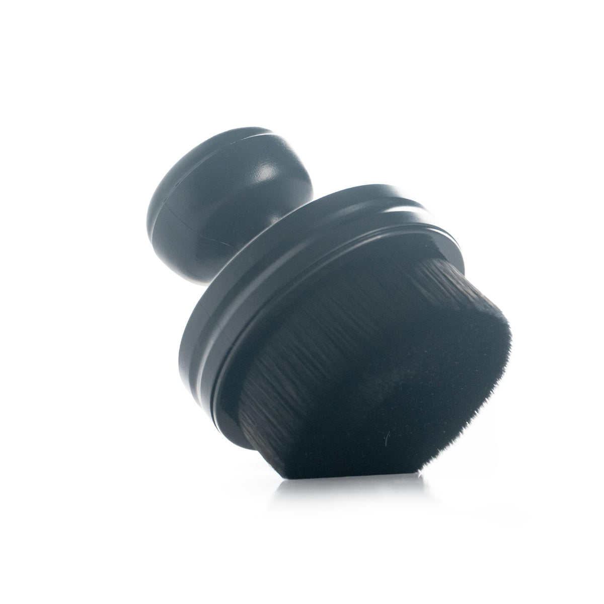 Detail Addictions tire and trim dressing brush with a round bristle head and domed grip