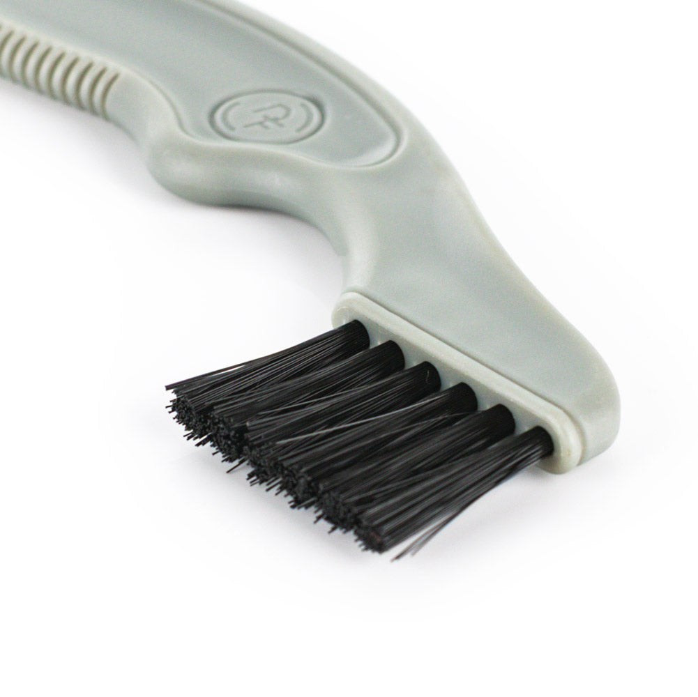 Cleaning brush with thin black bristles on a white background
