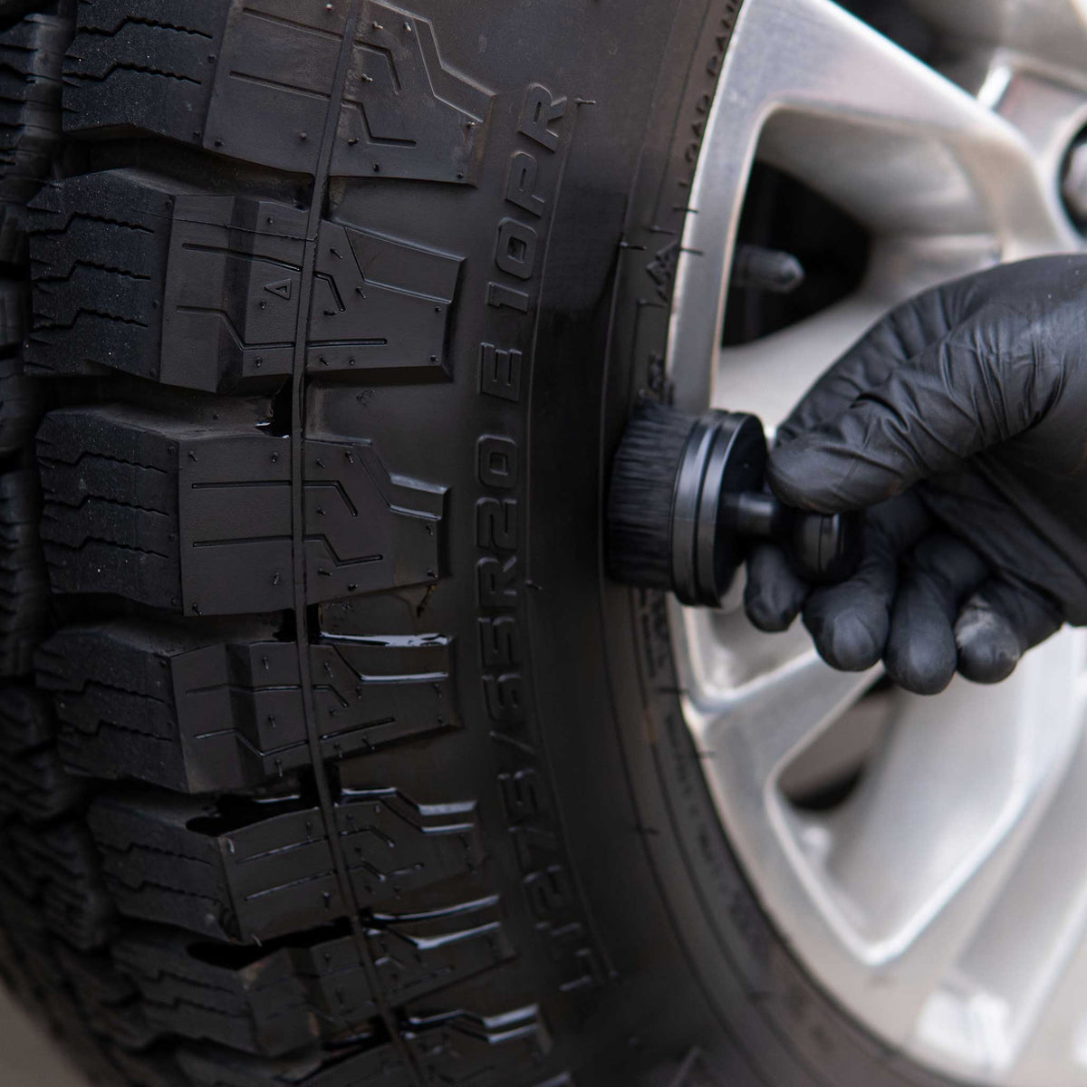 Nasiol Detailer Shine applied to an all-terrain tire sidewall with a round applicator