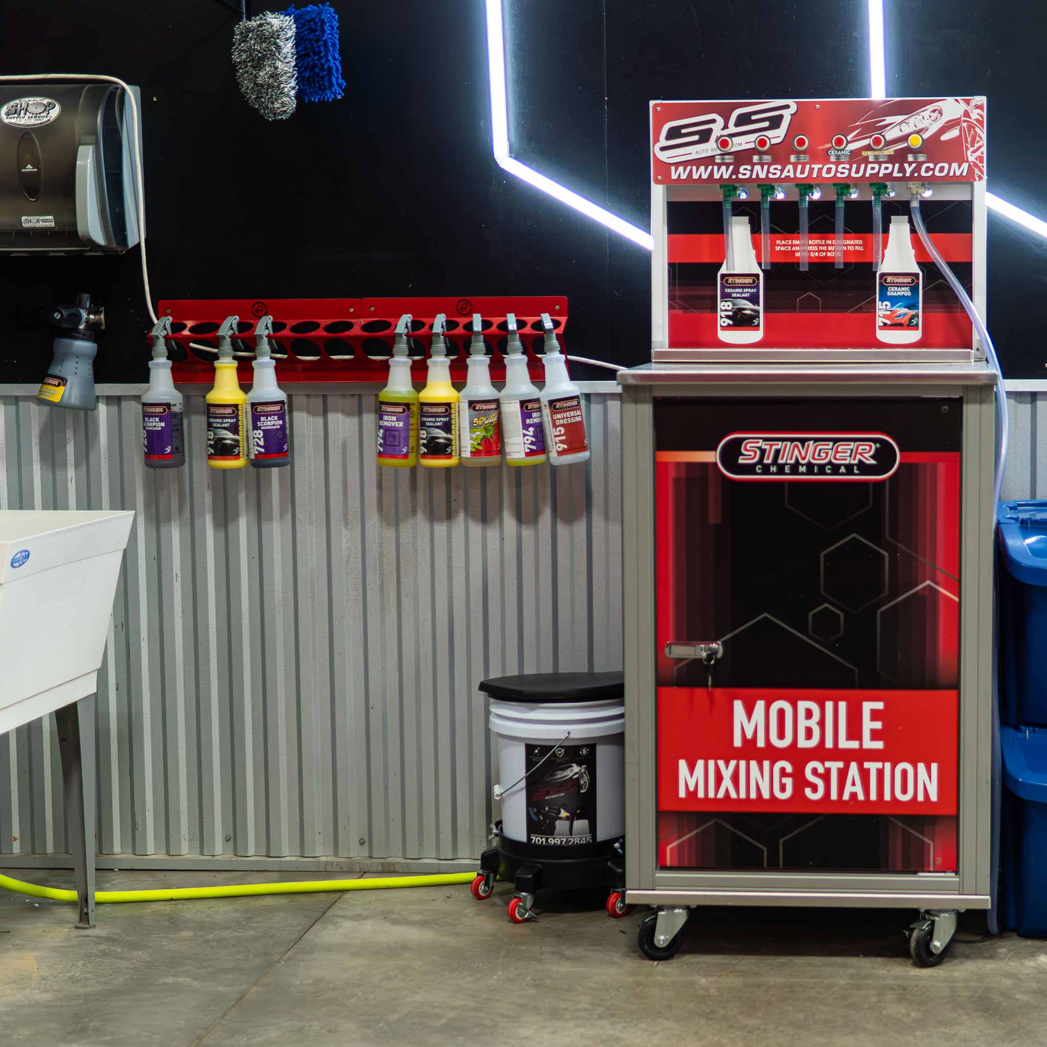 Stinger Mobile Mixing Station with various automotive products in a garage setting