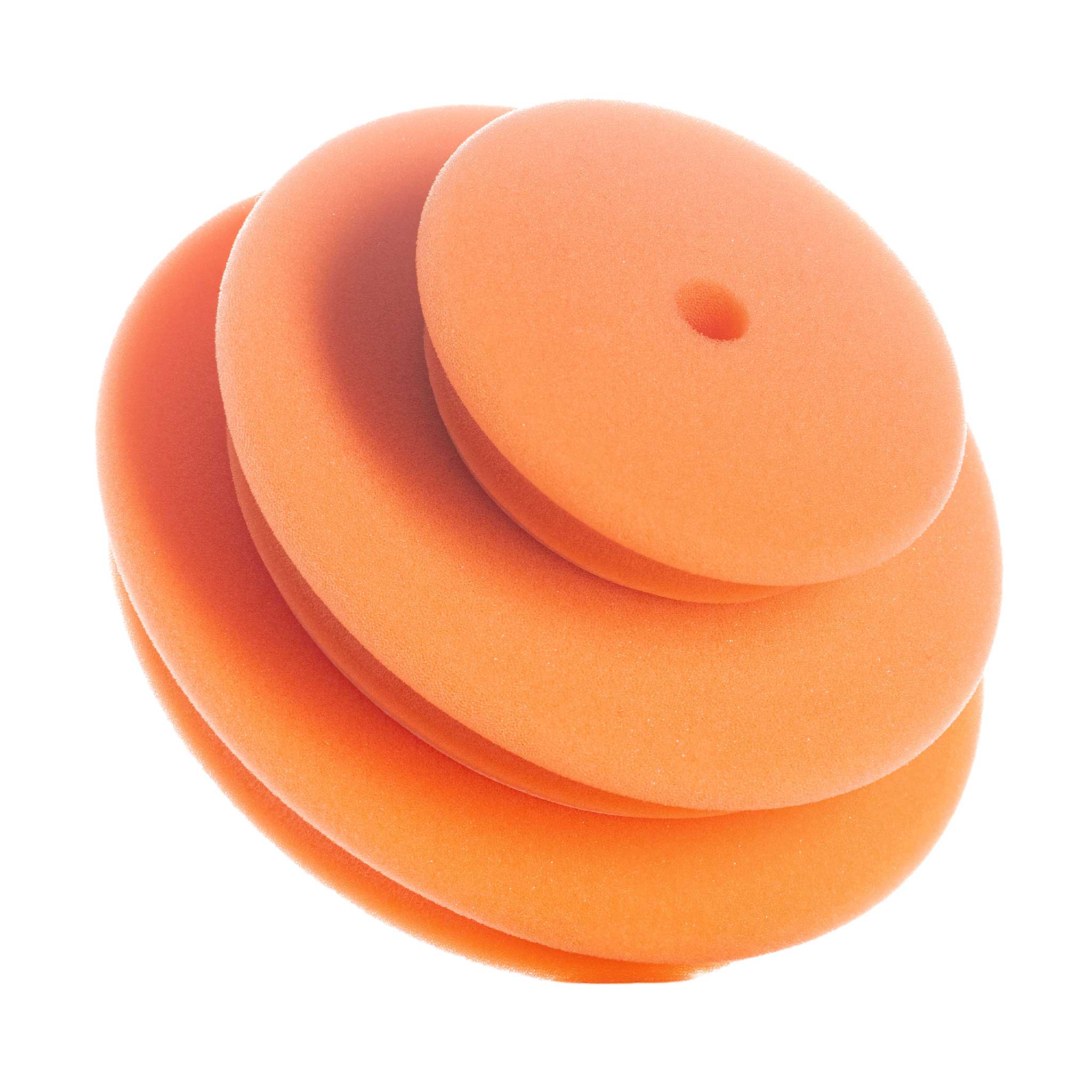 Stack of agent orange polishing pads on a white background
