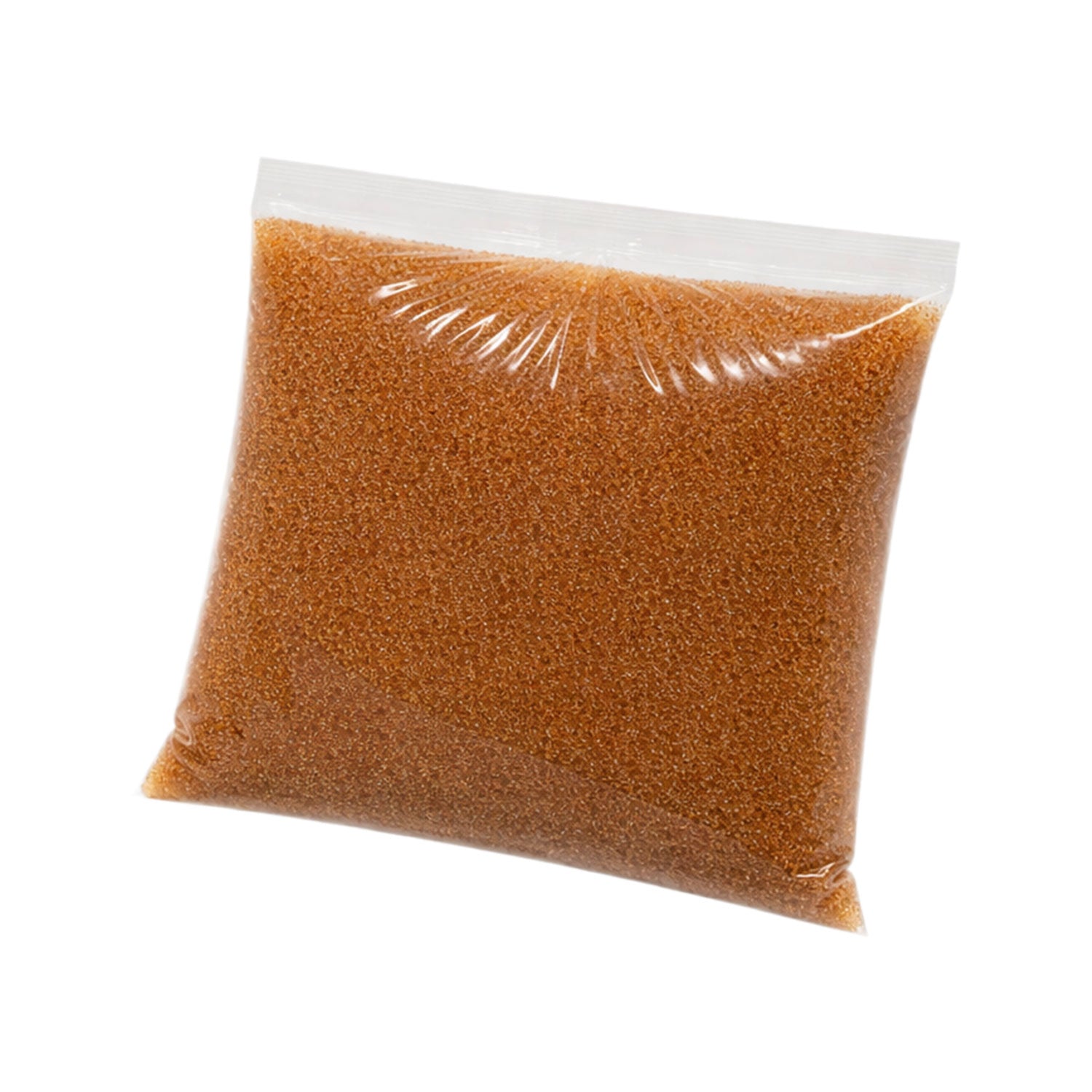 Clear plastic bag filled with brown ion resin on a white background