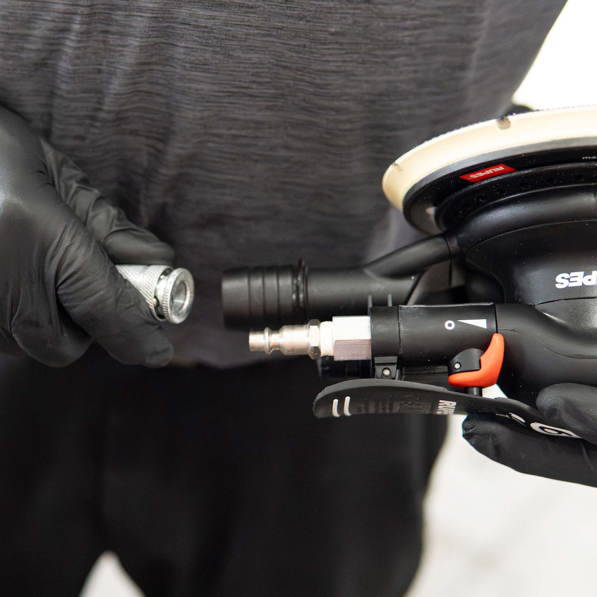 Connecting an air hose quick coupler to the inlet of a RUPES Skorpio III sander