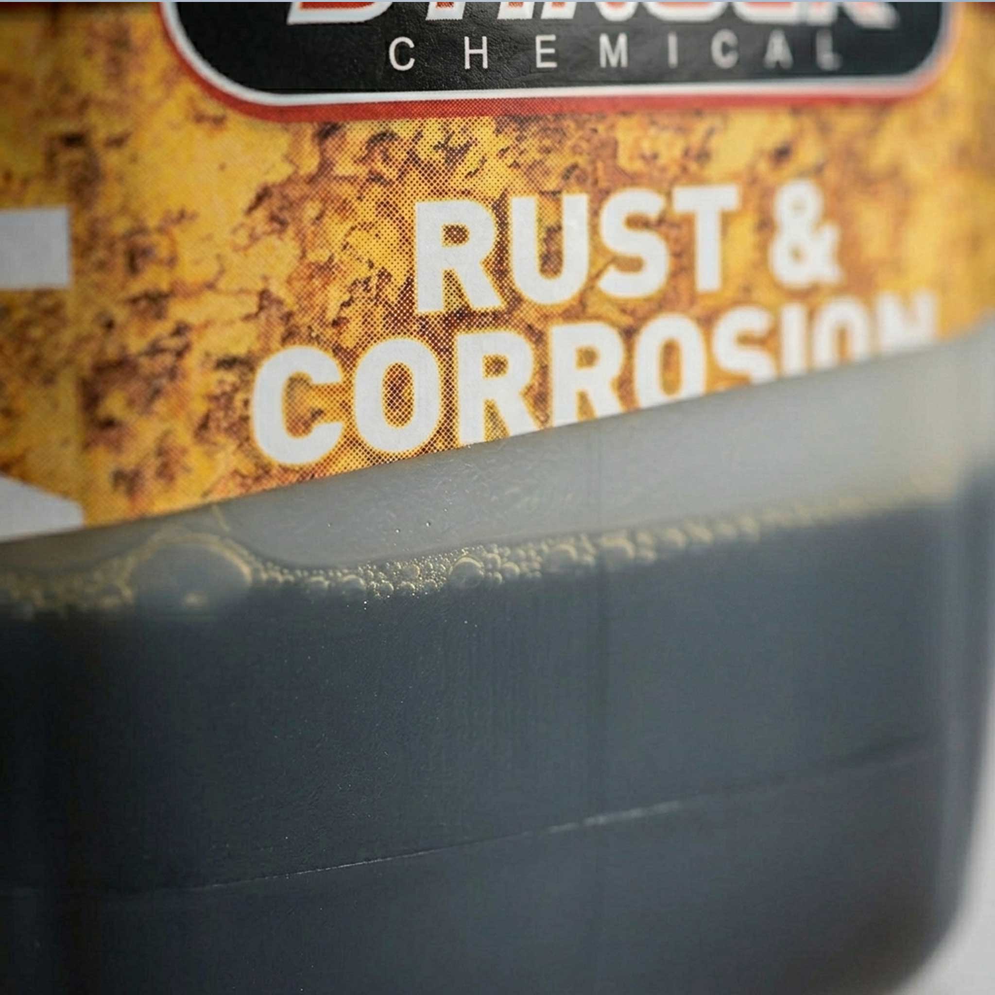 Rust and corrosion inhibitor 5 gallon jug close up with label cut off
