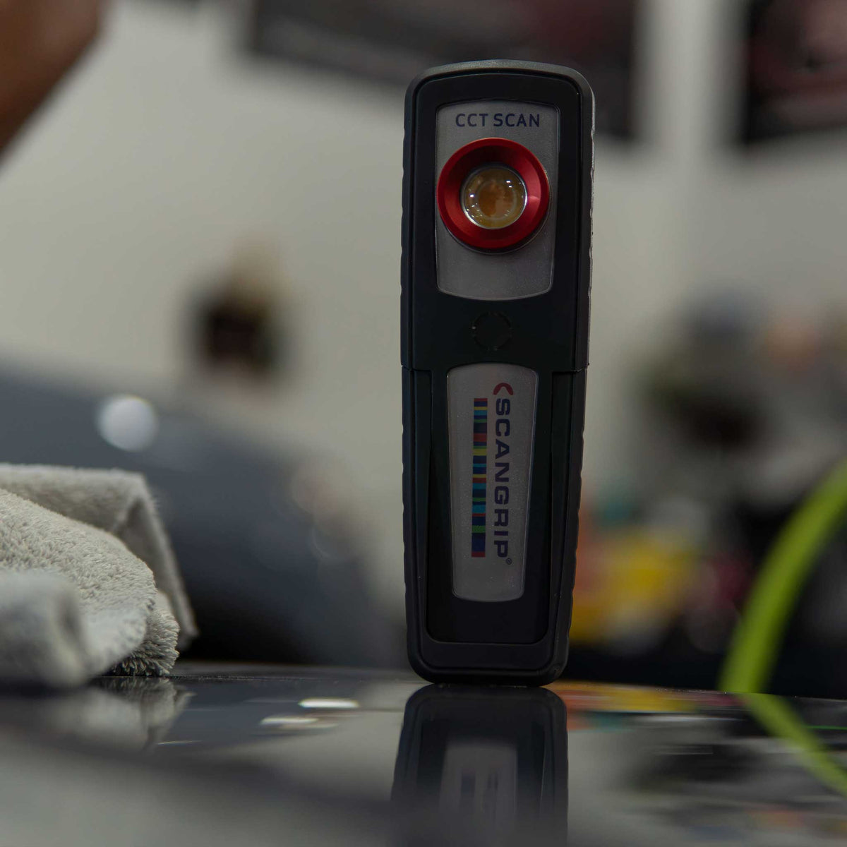 sunmatch 4 detailing light on a car hood during a sanding demonstration
