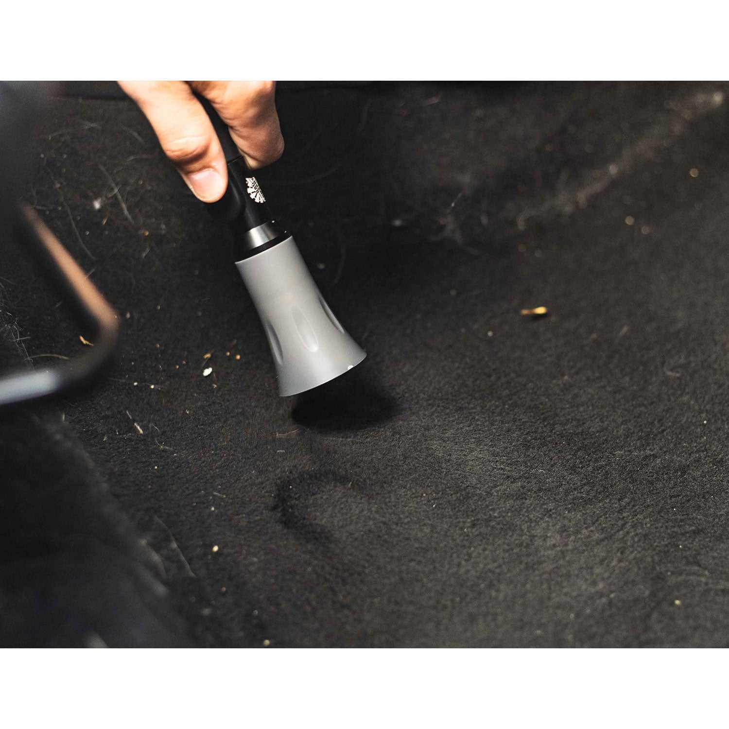 TRC Ultra Air Mini Blaster on a carpet in a mazda car