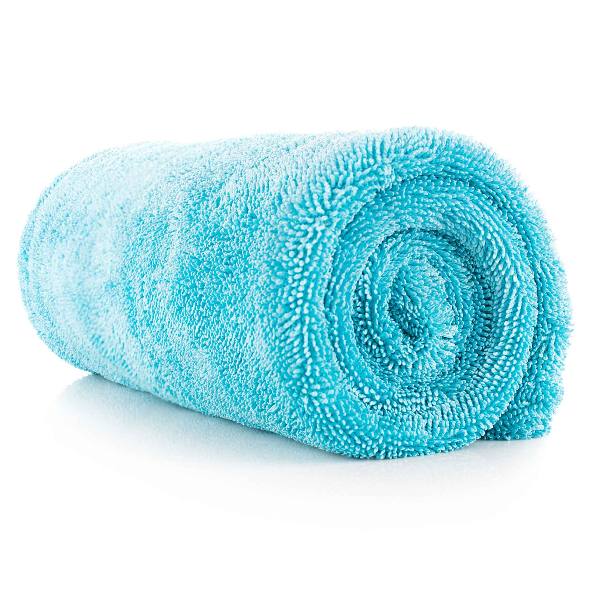 A rolled-up turquoise blue microfiber drying towel on a clean white background.
