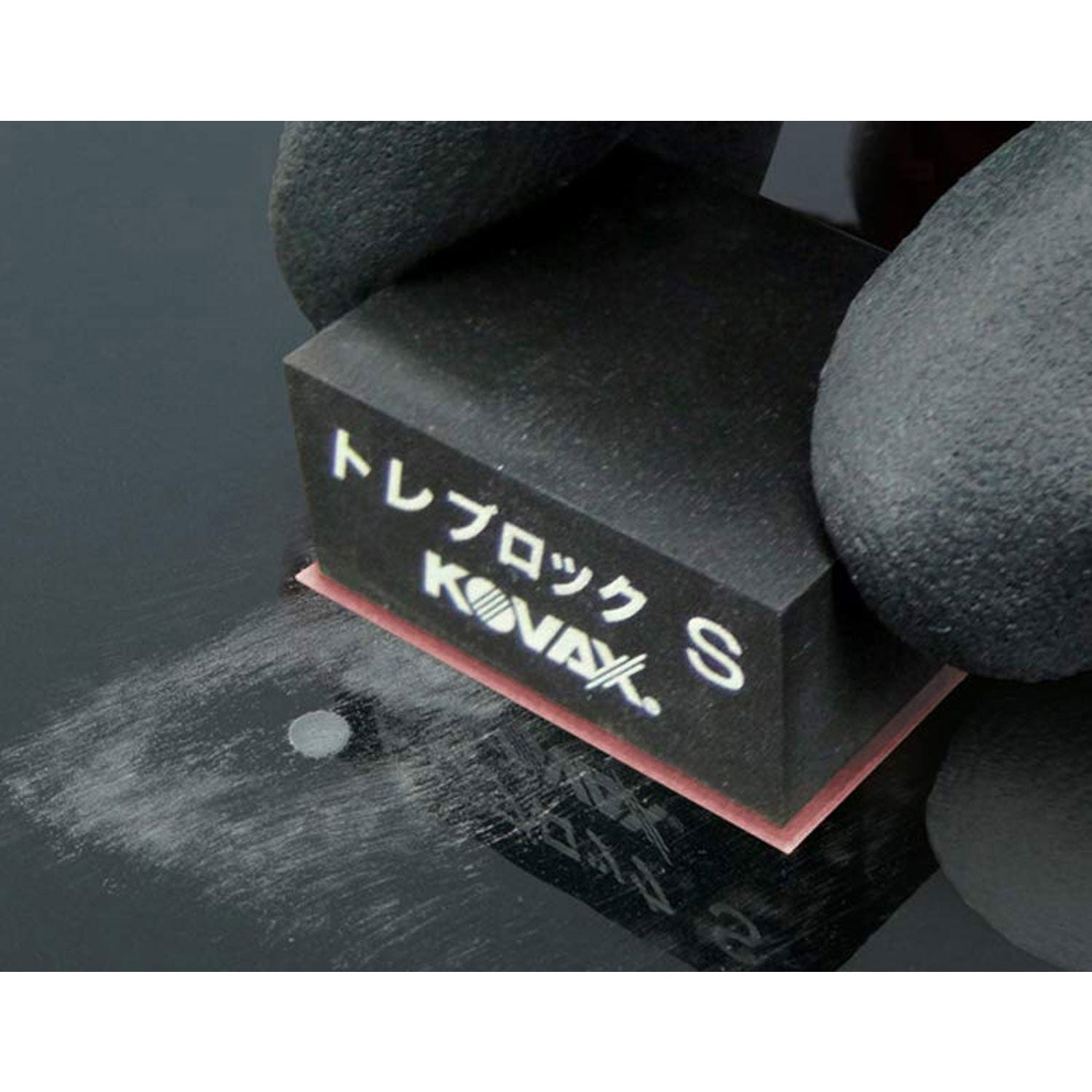 Tolecut toleblock with 1500 grit sanpaper removing a nib on a car hood