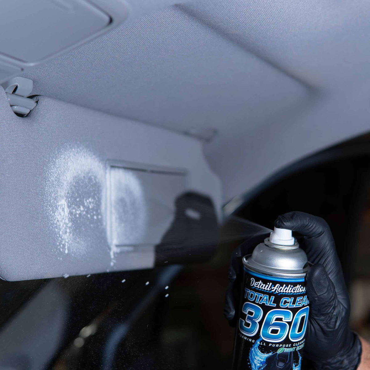 Detail Addictions Total Clean 360 foam sprayed on a fabric sun visor under the car headliner