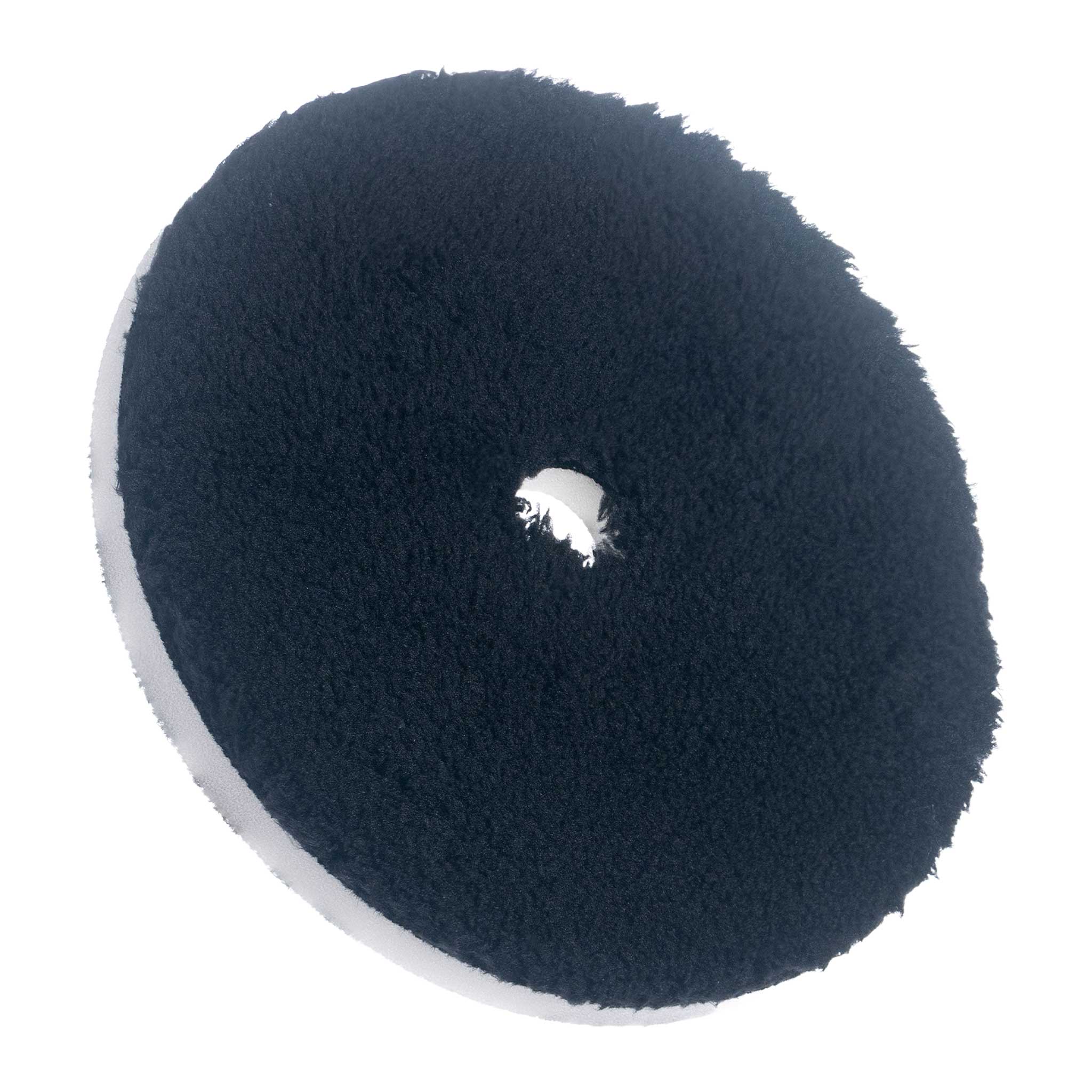 One 6 inch black microfiber polishing pad on a white background