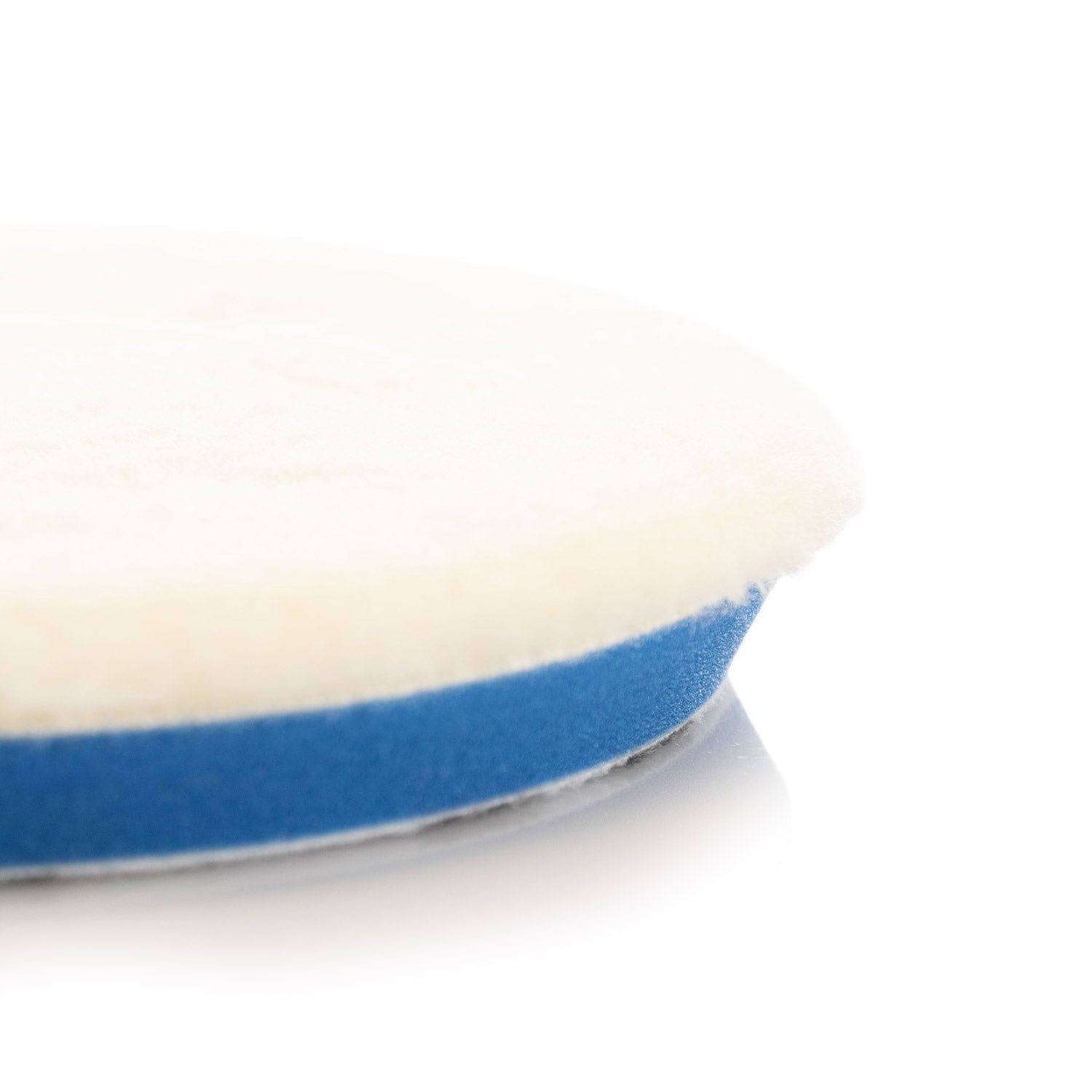 White Uro-Wool pads wool and beveled edge on a white background